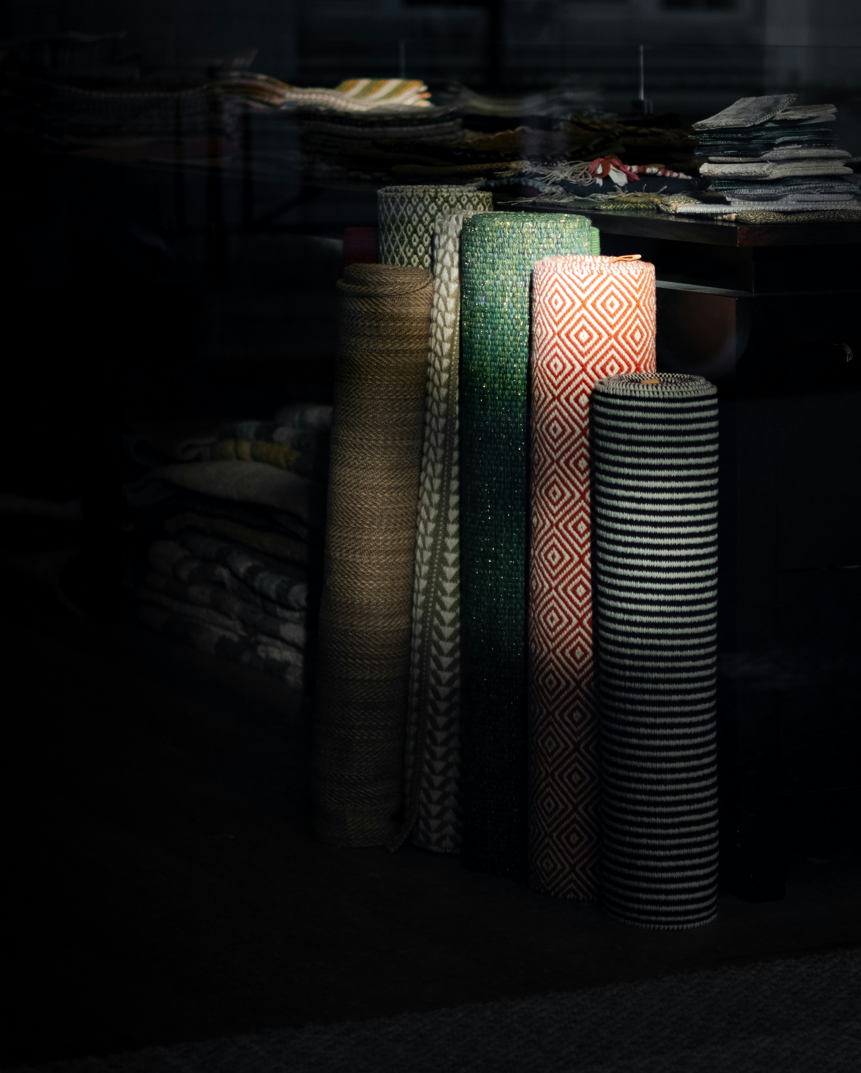 UNS atelier — rug rolls in the studio